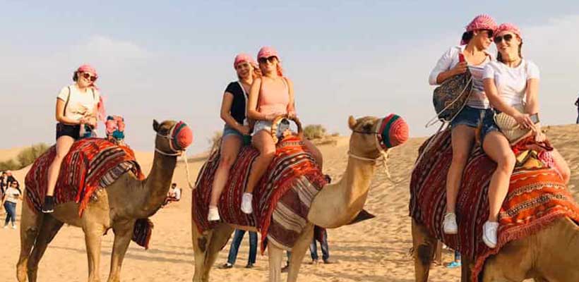 VIP Desert Safari 9 Tourist doing Camel Ride during Dubai Desert Safari